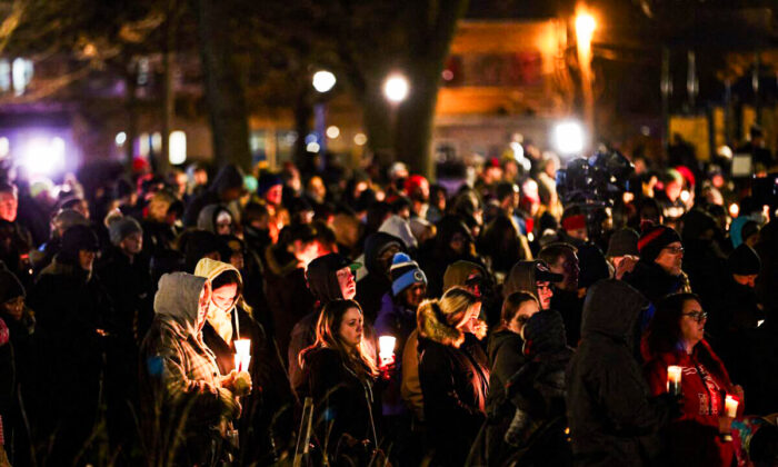 People attend a candlelight vigil in Cutler Park in Waukesha, Wis., on Nov. 22, 2021. (Mustafa Hussain/AFP via Getty Images)
