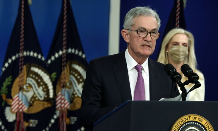 Federal Reserve Board Chair Jerome Powell (L) speaks as Lael Brainard (R) listens during an announcement at the South Court Auditorium of Eisenhower Executive Office Building in Wash., on Nov. 22, 2021. (Alex Wong/Getty Images)
