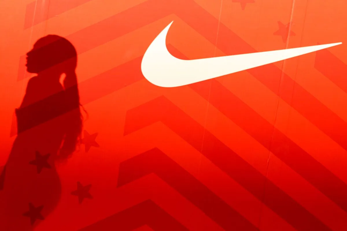 The shadow of Allyson Felix is seen next to a Nike logo after finishing second place in the Women's 400 Meters Final on day three of the 2020 U.S. Olympic Track & Field Team Trials at Hayward Field in Eugene, Oreg., on June 20, 2021. (Patrick Smith/Getty Images)
