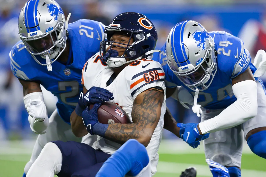 Chicago Bears running back David Montgomery (32) gets tackeld by Detroit Lions cornerback Amani Oruwariye (24) and free safety Tracy Walker III (21) during the first quarter at Ford Field in Detroit, Michigan, USA, on Nov 25, 2021. (Raj Mehta-USA TODAY Sports via Field Level Media)