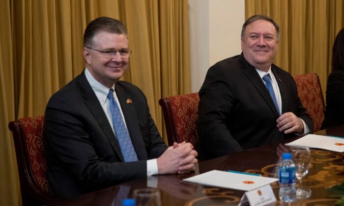 U.S. Secretary of State Mike Pompeo (R) and U.S. Ambassador to Vietnam Daniel Kritenbrink (L) attend a meeting with Vietnamese Foreign Minister Pham Binh Minh at the Ministry of Foreign Affairs in Hanoi, Vietnam, on Febr. 26, 2019. (Andrew Harnik/Pool via Reuters)