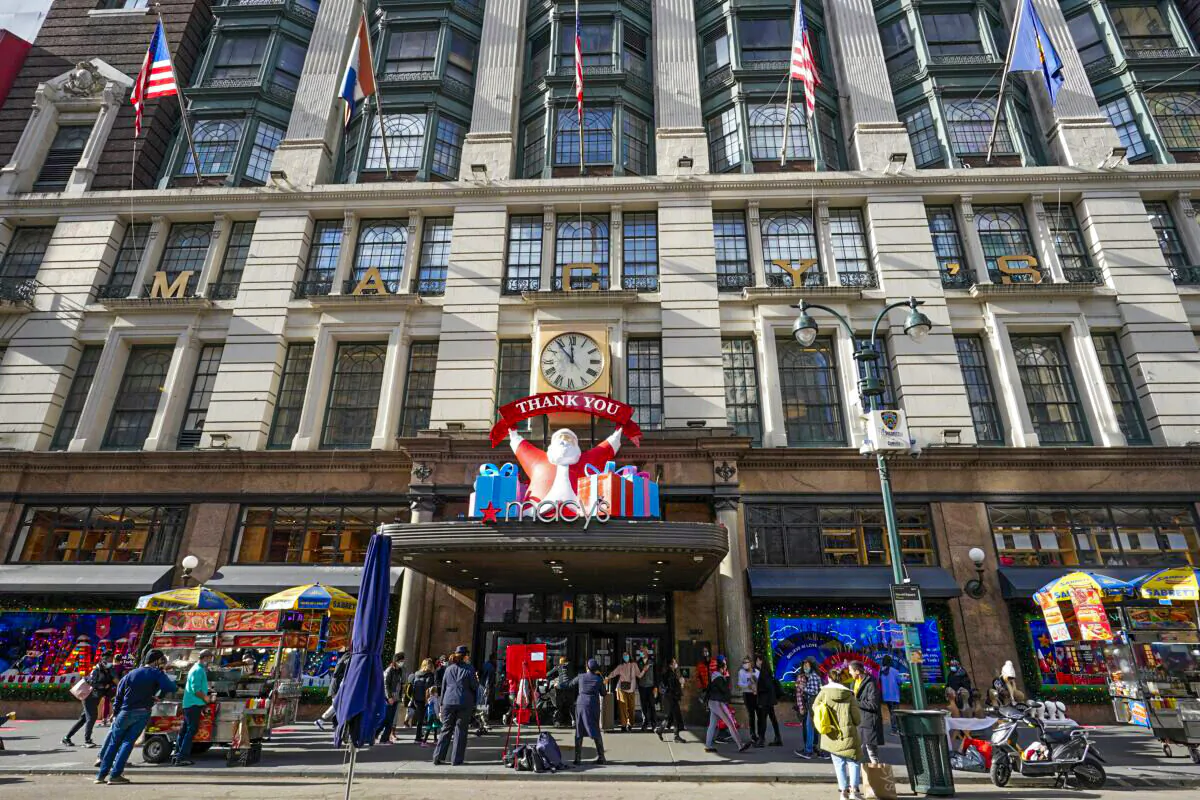 Black Friday shoppers walk past Macy's flagship store in New York's Herald Square, on Nov. 27, 2020.  (Mary Altaffer/AP Photo)