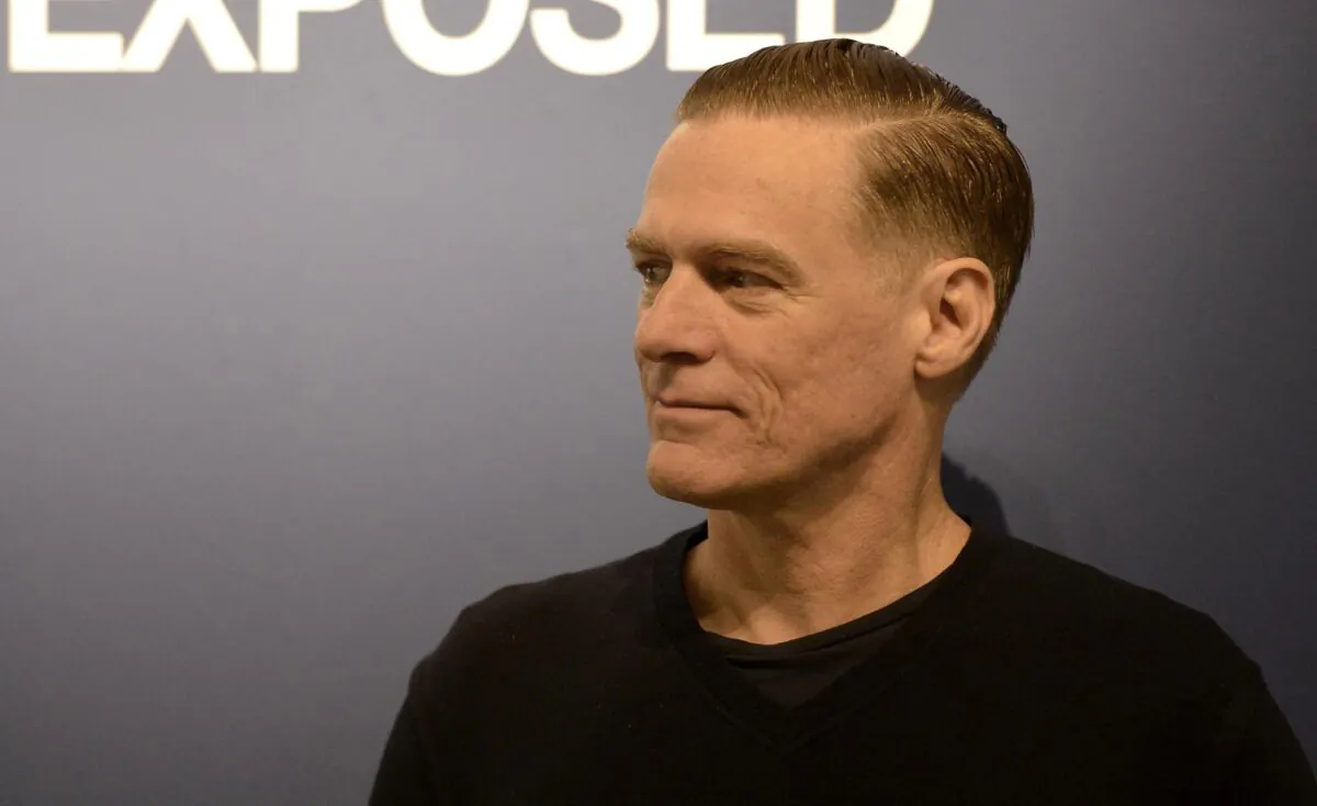 Canadian rock star Bryan Adams poses during the opening of his photo exhibition in Duesseldorf, Germany, on Feb. 1, 2013. (Martin Meissner/AP Photo)