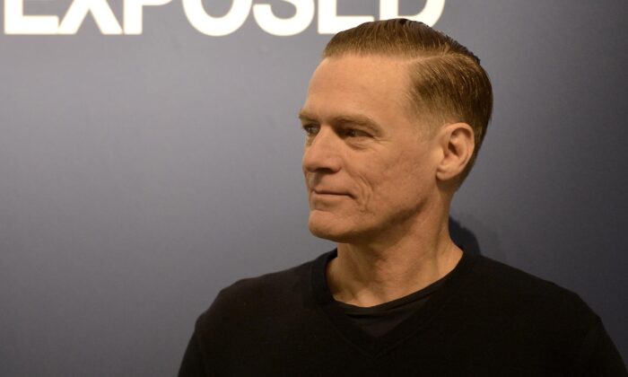 Canadian rock star Bryan Adams poses during the opening of his photo exhibition in Duesseldorf, Germany, on Feb. 1, 2013. (Martin Meissner/AP Photo)
