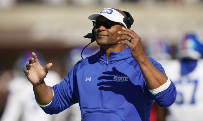 Tennessee State head coach Eddie George gestures as his team takes the field during the first half of an NCAA college football game against Mississippi State in Starkville, Miss., on Nov. 20, 2021. (Rogelio V. Soli/AP Photos)