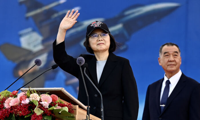 Taiwan President Tsai Ing-wen (L) waves at an upgraded U.S.-made F-16 V fighter as Defence Minister Chiu Kuo-cheng looks on during a ceremony at the Chiayi Air Force in southern Taiwan on Nov. 18, 2021. (Sam Yeh/AFP via Getty Images)