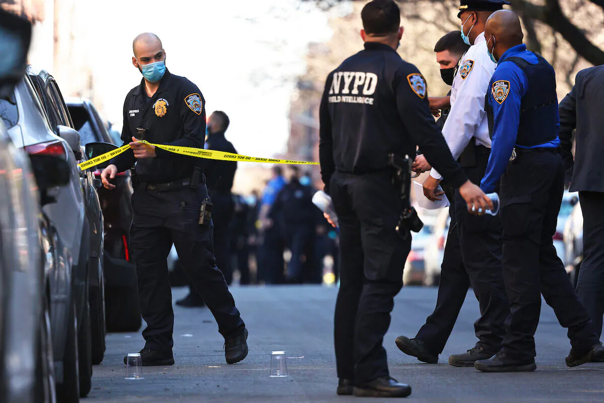 NYPD officers respond to the scene of a shooting that left multiple people injured in the Flatbush neighborhood of the Brooklyn borough on April 06, 2021 in New York City. (Michael M. Santiago/Getty Images)