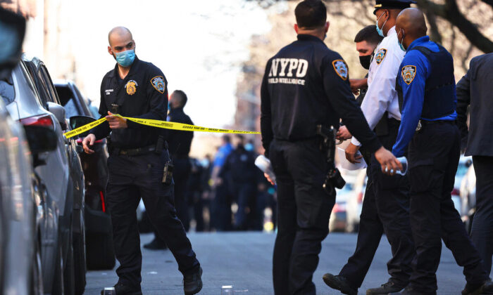 NYPD officers respond to the scene of a shooting that left multiple people injured in the Flatbush neighborhood of the Brooklyn borough on April 06, 2021 in New York City.  (Michael M. Santiago/Getty Images)