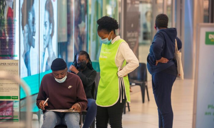 People wait to get vaccinated at a shopping mall, in Johannesburg, South Africa, on Nov. 26, 2021. (Denis Farrell/AP Photo)