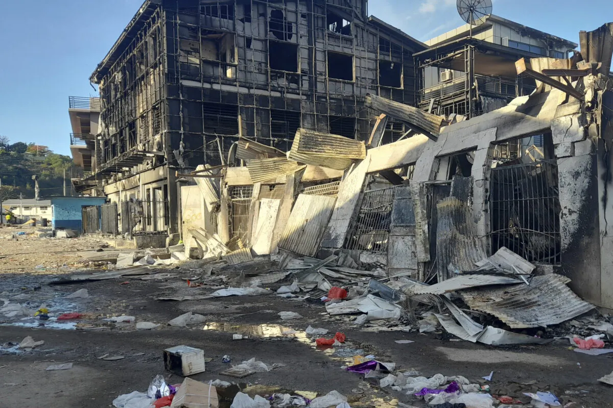 This photo shows aftermath of a looted street in Honiara's Chinatown, Solomon Islands, on Nov. 27, 2021. (Piringi Charley/AP Photo)