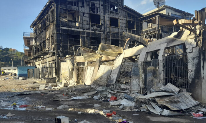 This aftermath of a looted street in Honiara's Chinatown, Solomon Islands, on Nov. 27, 2021. (Piringi Charley/AP Photo)