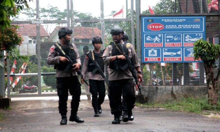 Indonesian security personnel patrol the perimeter of Gunung Sindur prison in Bogor on Jan. 22, 2019, where radical cleric Abu Bakar Bashir, believed to have been a key figure in terror network Jemaah Islamiyah (JI) which was blamed for the 2002 Bali bombings, is jailed. (Tjahyadi Ermawan/AFP via Getty Images)