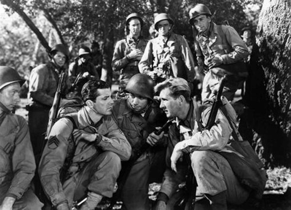platoon discussing strategy during WWII