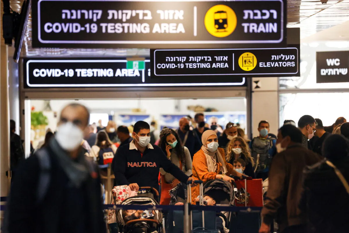 Travelers exit a COVID-19 pandemic testing area at Ben Gurion International Airport as Israel imposes new restrictions near Tel Aviv, Israel, on Nov. 28, 2021. (Amir Cohen/Reuters)