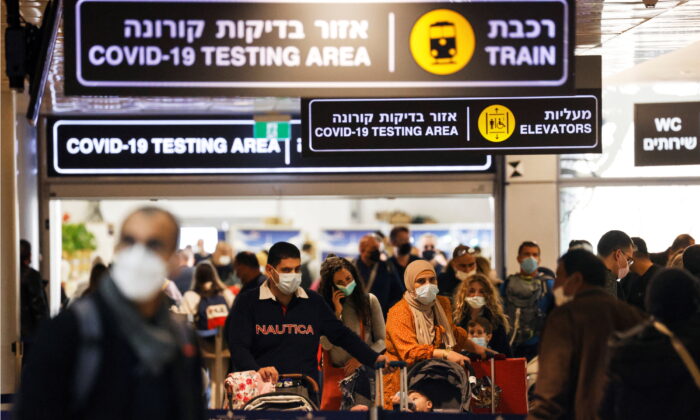 Travelers exit a COVID-19 pandemic testing area at Ben Gurion International Airport as Israel imposes new restrictions near Tel Aviv, Israel, on Nov. 28, 2021. (Amir Cohen/Reuters)