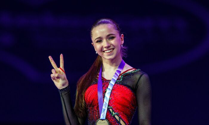 Russia's Kamila Valieva poses as she celebrates winning the gold medal for the women's competition at the Rostelecom Cup 2021 ISU Grand Prix of Figure Skating in Sochi, Russia, on Nov. 28, 2021. (Dimitar Dilkoff/AFP via Getty Images)