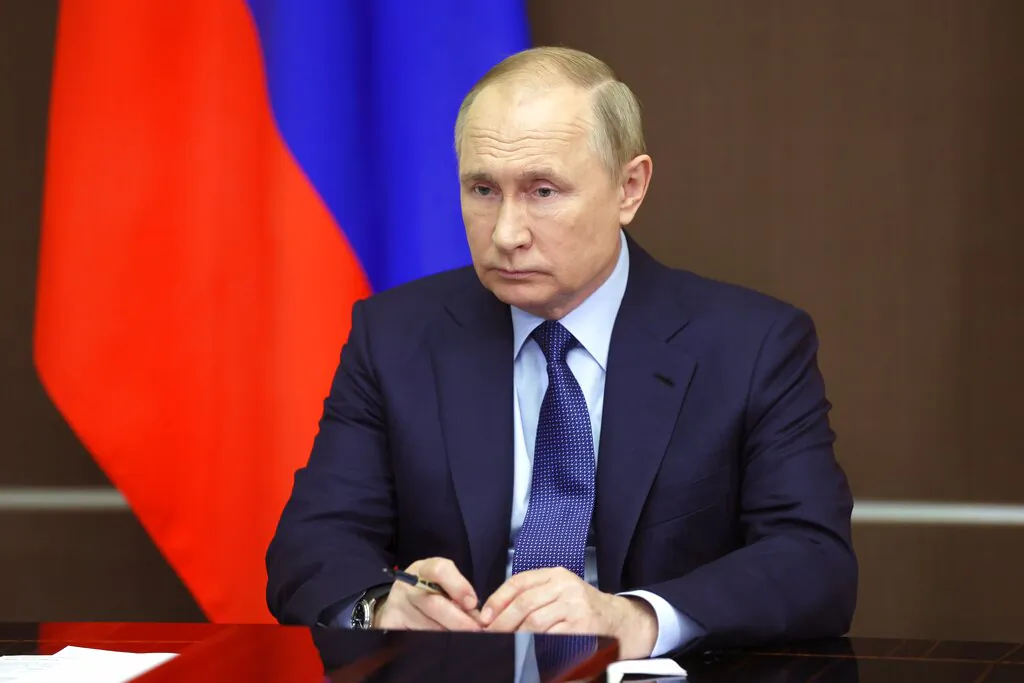Russian President Vladimir Putin attends a cabinet meeting via video link, at the Bocharov Ruchei residence in the Black Sea resort of Sochi, Russia, on Nov. 24, 2021. (Mikhail Metzel, Sputnik, Kremlin Pool Photo via AP)