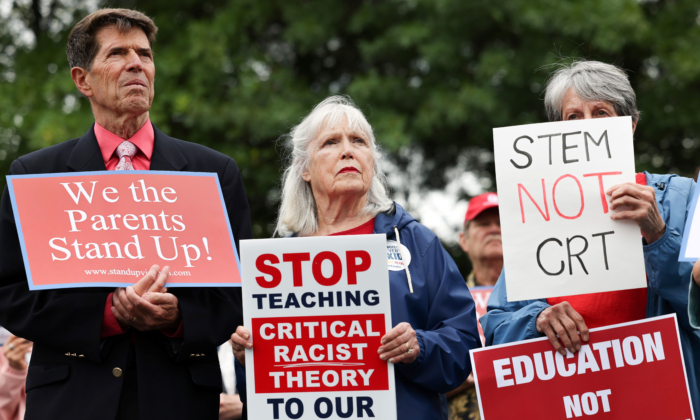 Opponents of the academic doctrine known as Critical Race ory protest outside of the Loudoun County School Board headquarters, in Ashburn, Virginia, U.S.  June 22, 2021. REUTERS/Evelyn Hockstein