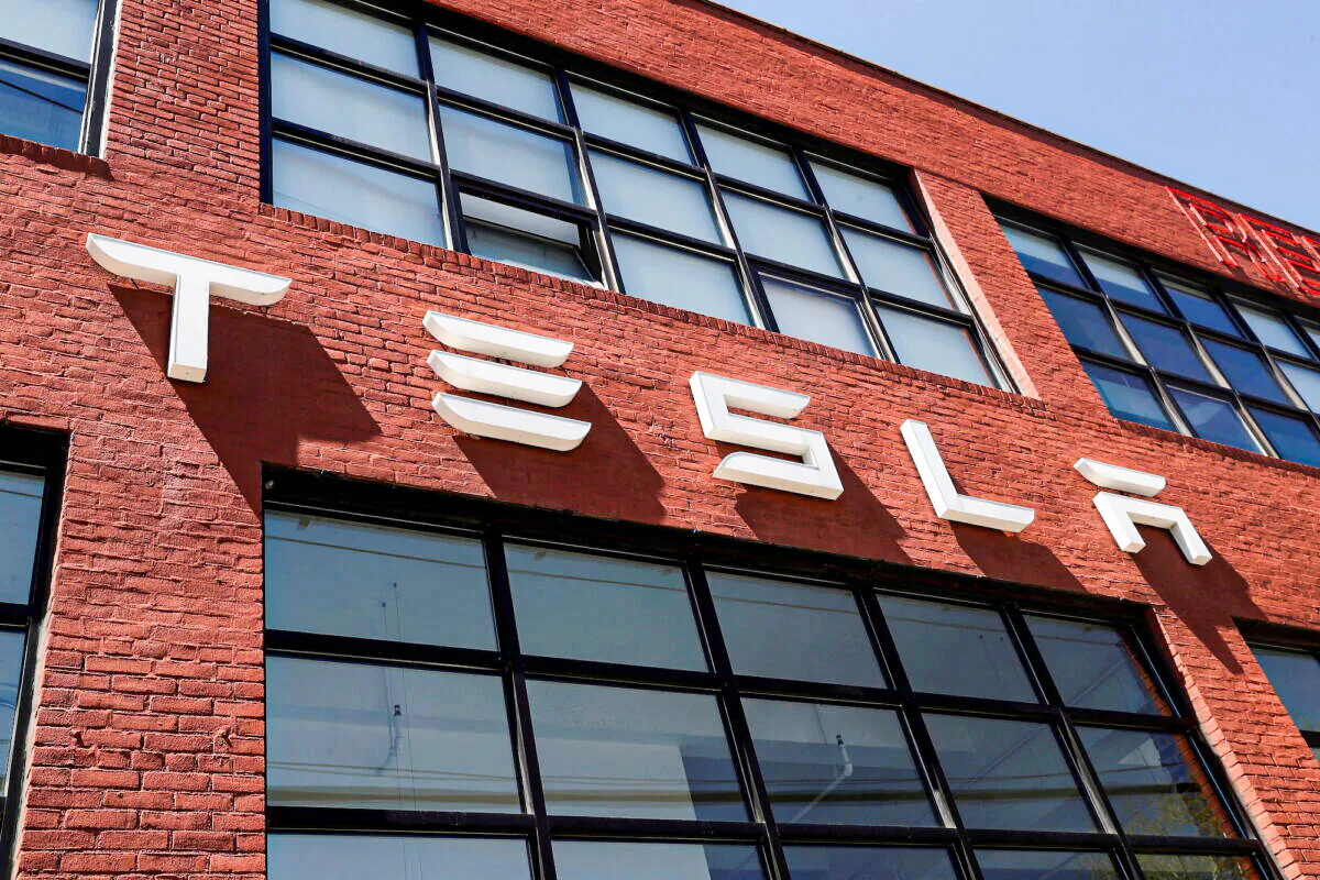 The Tesla logo is seen outside a dealership in the Brooklyn borough of New York on April 26, 2021. (Shannon Stapleton/Reuters)