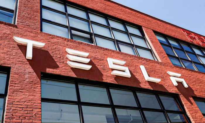 The Tesla logo is seen outside a dealership in the Brooklyn borough of New York on April 26, 2021. (Shannon Stapleton/Reuters)