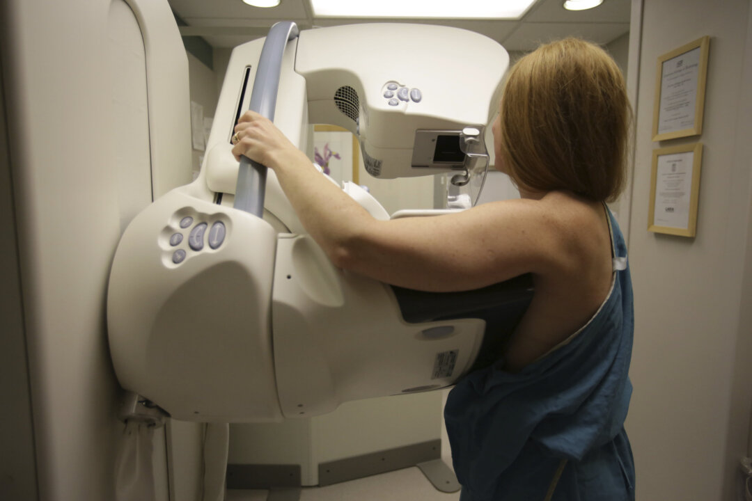 A woman gets a mammogram at the University of Michigan Cancer Center in Ann Arbor, Mich., on May 22, 2015. (Detroit Free Press via AP, File/Kimberly P. Mitchell)