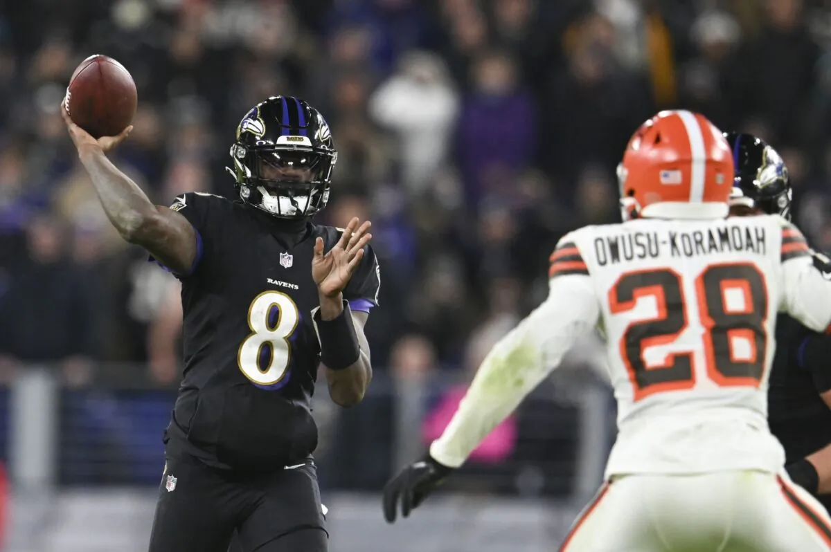 Baltimore Ravens quarterback Lamar Jackson (8) throws as Cleveland Browns outside linebacker Jeremiah Owusu-Koramoah (28) defends during the second half at M&T Bank Stadium in Baltimore, on Nov 28, 2021. (Tommy Gilligan/USA TODAY Sports via Field Level Media)