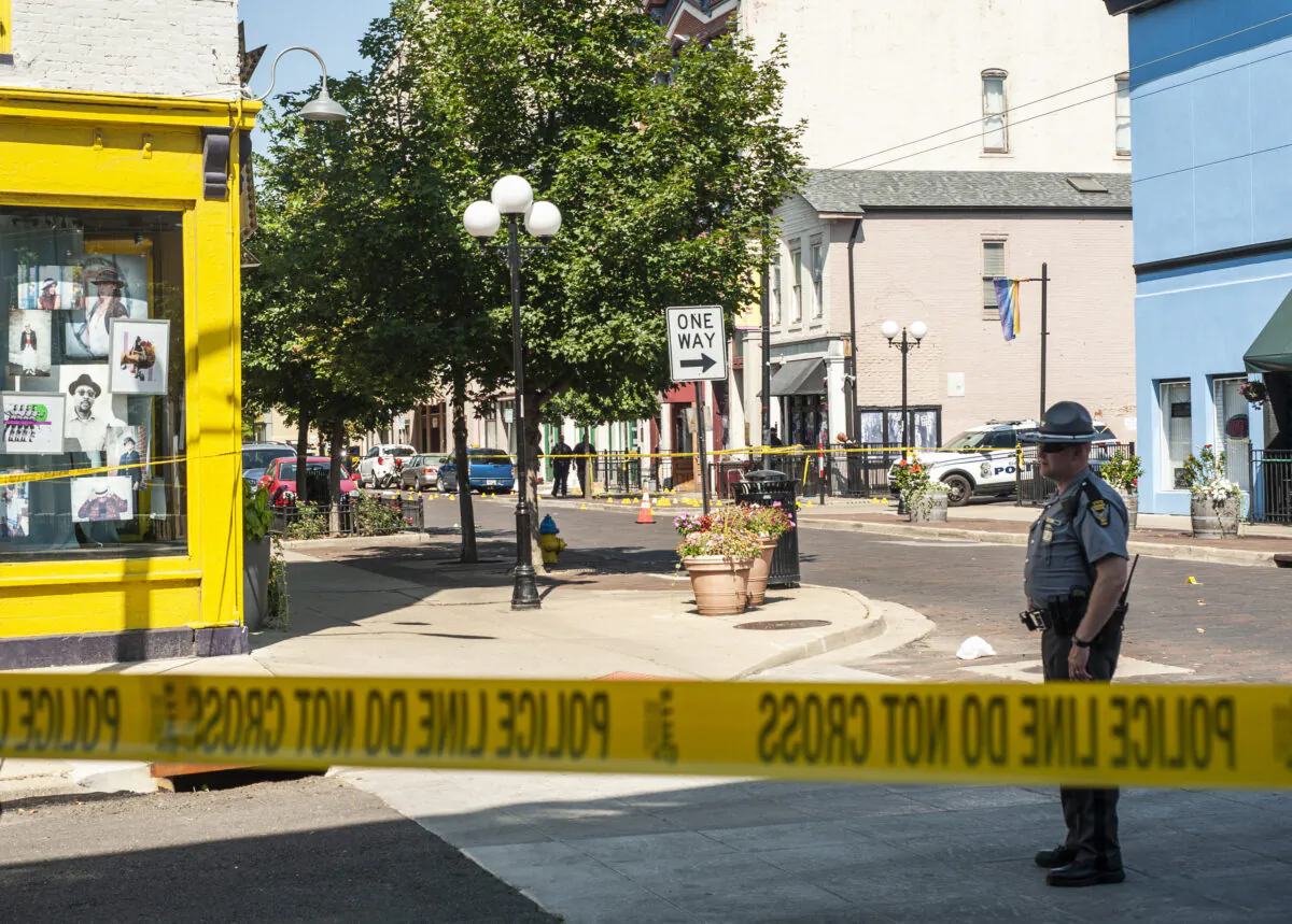 Law enforcement officials investigate the scene where a gunman opened fire on a crowd of people over night on Fifth Avenue in the Oregon District in Dayton, Ohio, on Aug. 4, 2019. (Matthew Hatcher/Getty Images)