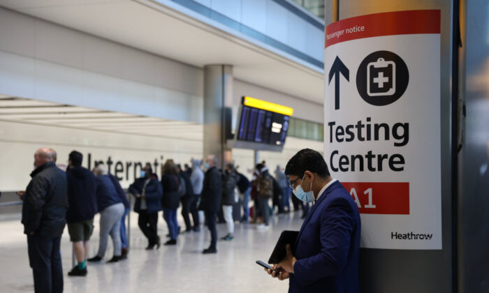A COVID-19 testing center sign at Heathrow Terminal 5, London, England on Nov. 28, 2021. (Hollie Adams/Getty Images)
