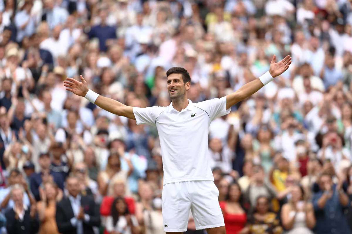 Novak Djokovic celebrates winning his men's Singles Final match against Matteo Berrettini of Italy on Day Thirteen of The Championships-Wimbledon 2021 at All England Lawn Tennis and Croquet Club in London on July 11, 2021. (Julian Finney/Getty Images)