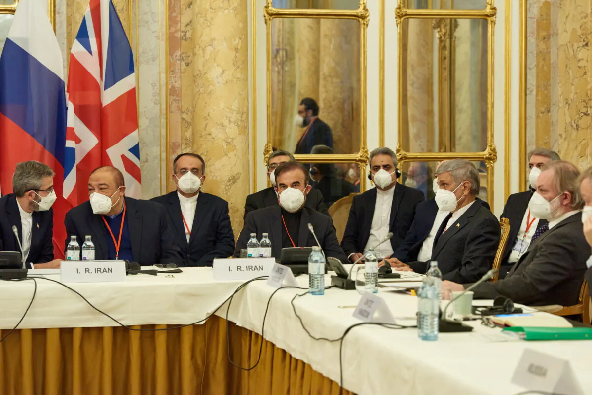Iran's chief nuclear negotiator Ali Bagheri Kani and members of the Iranian delegation wait for the start of a meeting of the JCPOA Joint Commission in Vienna, Austria November 29, 2021. (EU Delegation in Vienna/Handout via REUTERS)