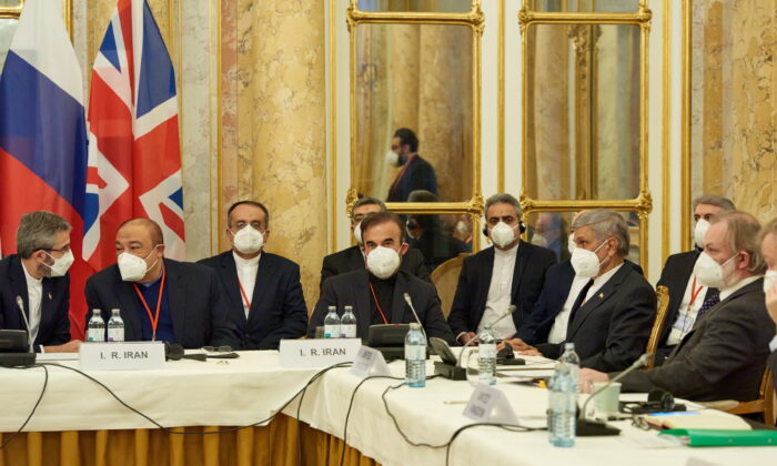 Iran's chief nuclear negotiator Ali Bagheri Kani and members of the Iranian delegation wait for the start of a meeting of the JCPOA Joint Commission in Vienna, Austria, on Nov. 29, 2021. (EU Delegation in Vienna/Handout via Reuters)