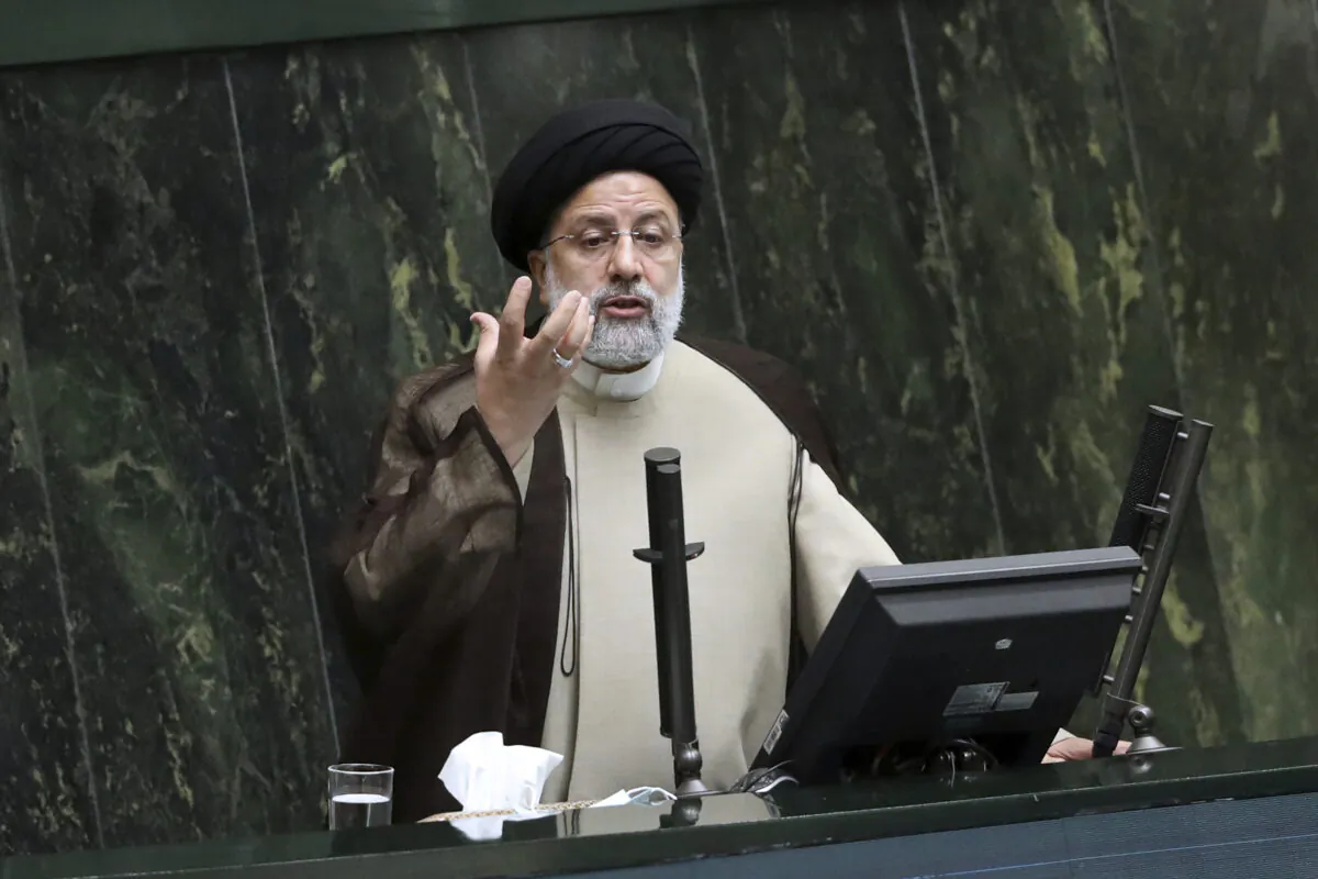 Iranian leader Ebrahim Raisi addresses parliament in Tehran, Iran, on Nov. 16, 2021. Mr. Raisi died in a helicopter crash on May 19, 2024. (Vahid Salemi/AP Photo)