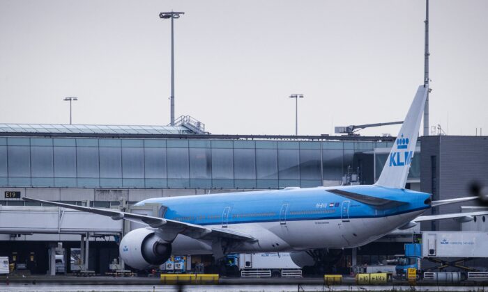 A KLM airplane landed from Johannesburg, South Africa, is parked at the gate E19 at the Schiphol Airport in the Netherlands on Nov. 27, 2021. (Sem Van Der Wal/ANP/AFP via Getty Images)