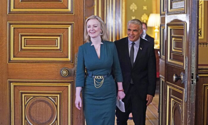 UK Foreign Secretary Liz Truss (L) with Israeli Foreign Minister Yair Lapid ahead of a meeting at the Foreign Office in London on Nov. 29, 2021. (PA)