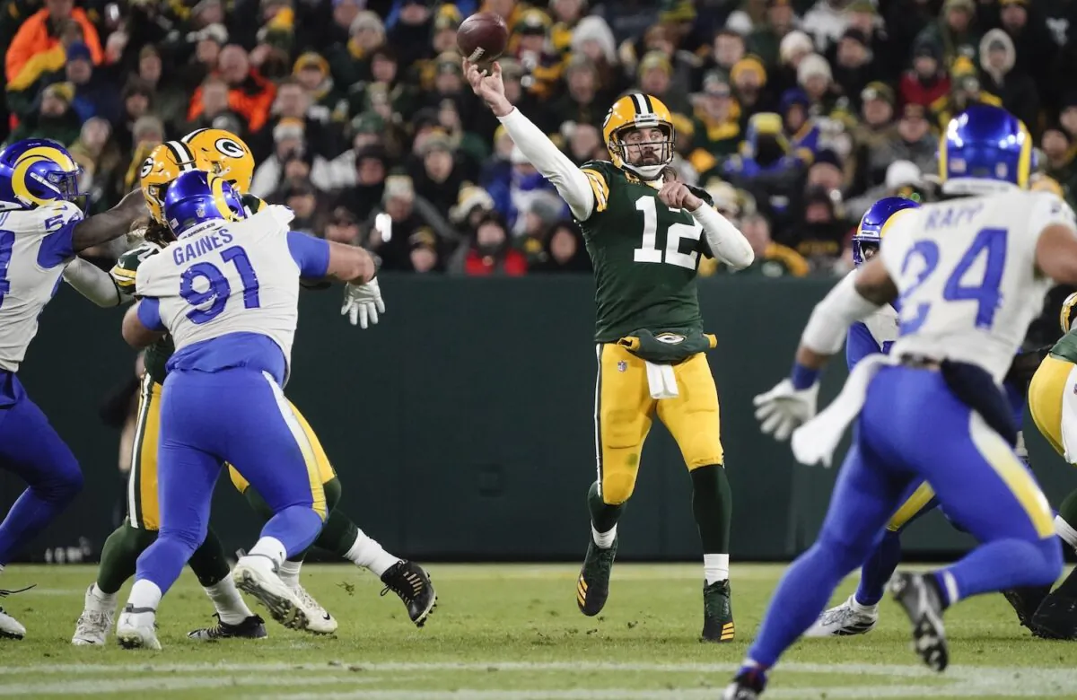 Green Bay Packers' Aaron Rodgers thorws a pass during the first half of an NFL football game against the Los Angeles Rams in Green Bay, Wis., on Nov. 28, 2021. (AP Photo/Morry Gash)