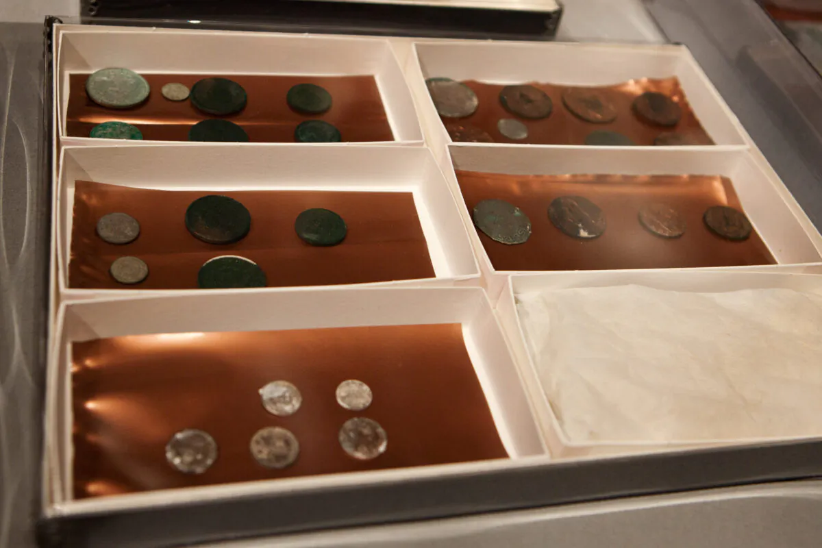 Silver and copper coins dating from 1652 to 1855, are displayed at the Museum of Fine Arts in Boston, on Jan. 6, 2015. (Kayana Szymczak/Getty Images)