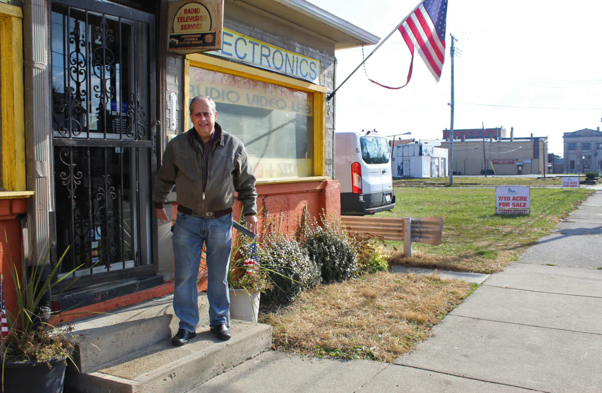 Joe Spanel outside his TV repair shop in the West Side neighborhood of Dayton, Ohio, on Nov. 28. (Michael Sakal/The Epoch Times)