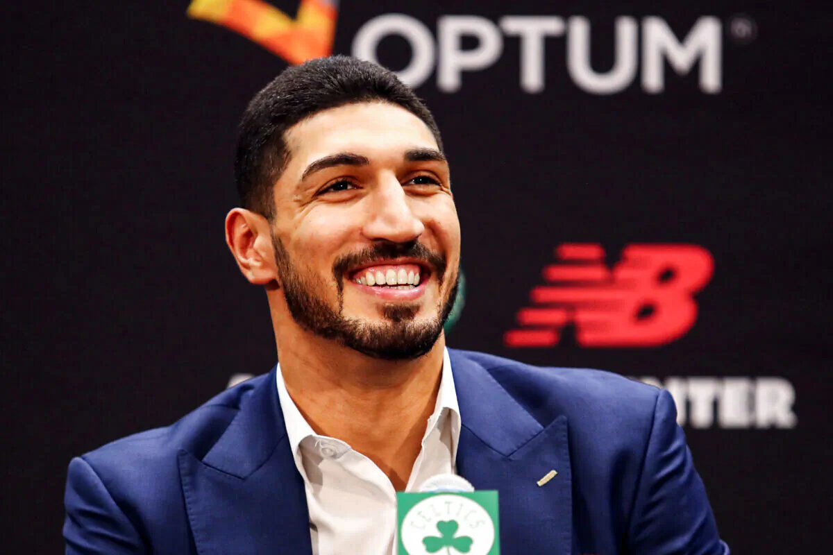 Enes Kanter reacts during a press conference as he is introduced as a member of the Boston Celtics at the Auerbach Center at New Balance World Headquarters in Boston on July 17, 2019. (Photo by Tim Bradbury/Getty Images)