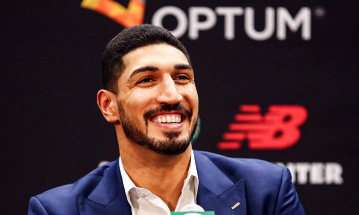 Enes Kanter reacts during a press conference as he is introduced as a member of the Boston Celtics at the Auerbach Center at New Balance World Headquarters in Boston, Massachusetts on July 17, 2019. (Photo by Tim Bradbury/Getty Images)