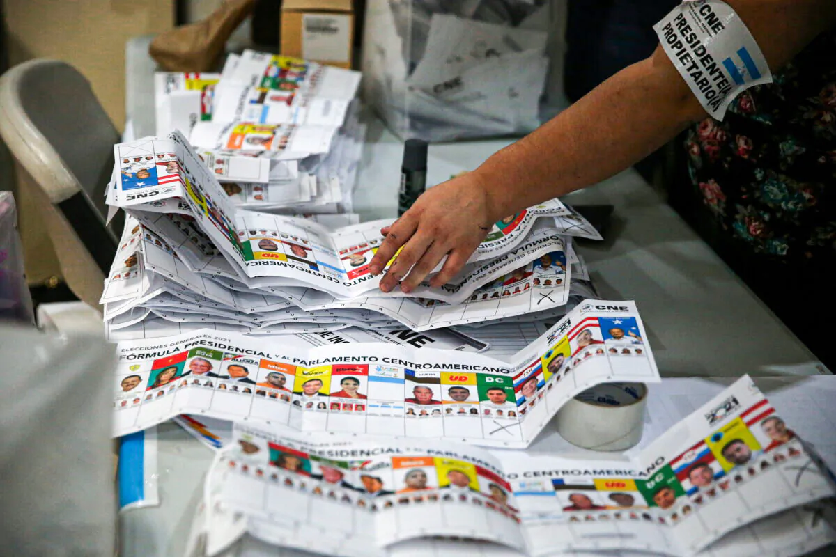 Election volunteers count votes during the general election, at a school in Catacamas, Honduras, on Nov. 28, 2021. (Jose Cabezas/Reuters)