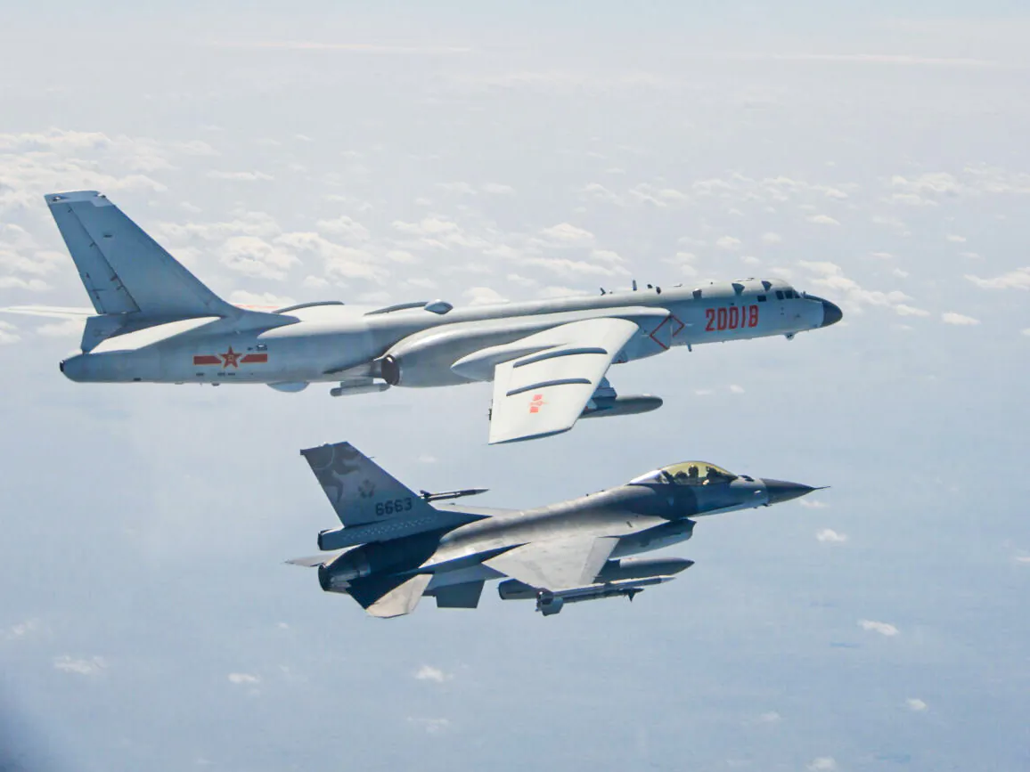 A Chinese PLA Air Force H-6 bomber flies near a Taiwan F-16 in this Feb. 10, 2020 handout photo provided by Taiwan Ministry of National Defense. In a statement, the ministry said Chinese J-11 fighters and H-6 bombers flew into the Bashi Channel to the south of Taiwan, then out into the Pacific before heading back to base via the Miyako Strait. (Taiwan Ministry of National Defense/Handout via Reuters)