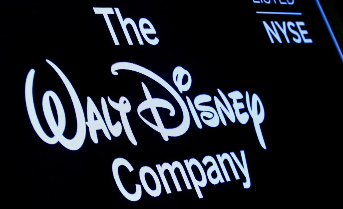 A screen shows the logo and a ticker symbol for the Walt Disney Company on the floor of the New York Stock Exchange, on Dec. 14, 2017. (Brendan McDermid/Reuters)