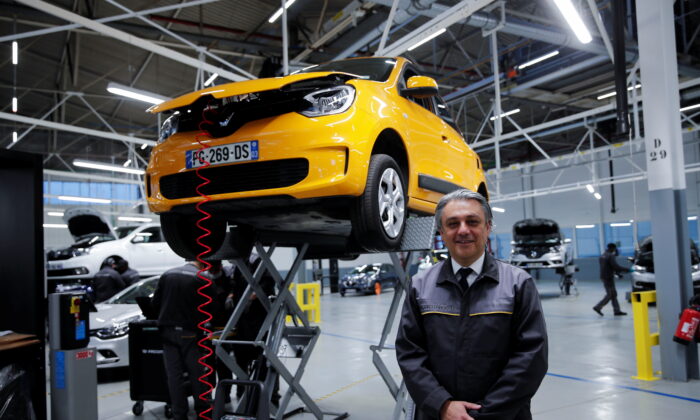 After the press conference, Renault CEO Luca de Meo will pose as part of a visit to introduce Re-Factory, a used car factory in Fran, France, on November 30, 2021.  (BenoitTessier / Reuters)
