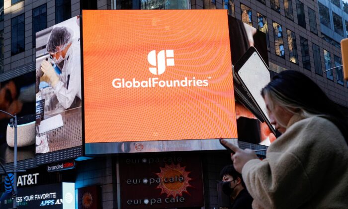 A screen displays the company logo for semiconductor and chipmaker GlobalFoundries Inc. during the company's IPO at the Nasdaq MarketSite in Times Square in New York City, on Oct. 28, 2021.  (Brendan McDermid/Reuters)