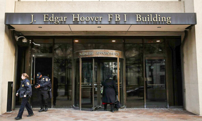 Law enforcement officers exit the J. Edgar Hoover FBI Building in Washington on Jan. 28, 2019. (Mark Wilson/Getty Images)