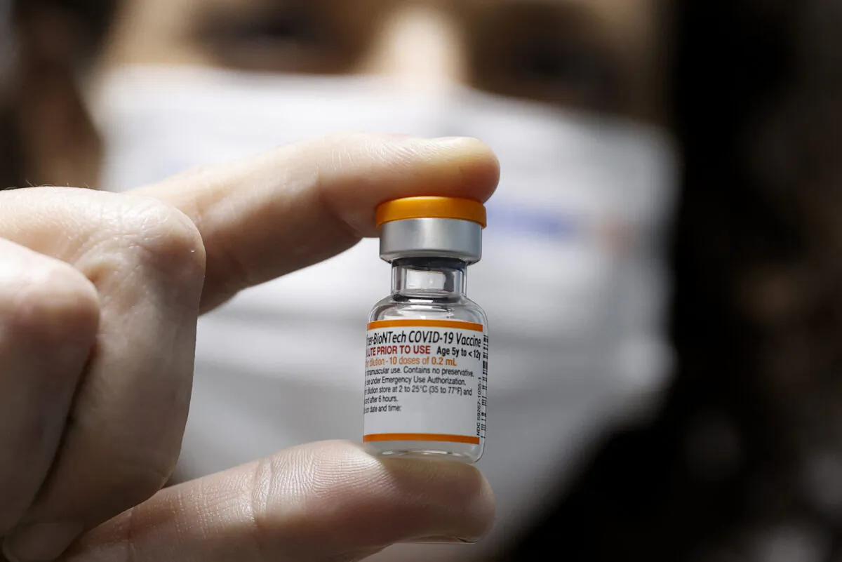 A health worker displays a vial of the Pfizer/BioNTech COVID-19 vaccine for children in Tel Aviv, Israel, on Nov. 22, 2021. (Jack Guez/AFP via Getty Images)