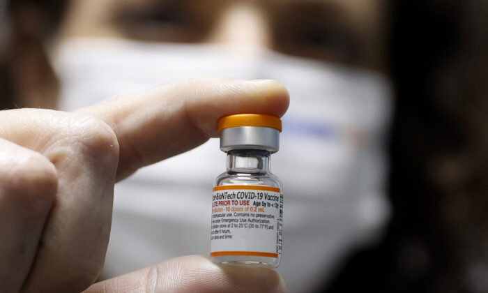 A health worker displays a vial of the Pfizer/BioNTech COVID-19 vaccine for children in Tel Aviv, Israel, on Nov. 22, 2021. (Jack Guez/AFP via Getty Images)
