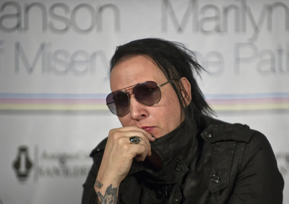 U.S. singer Marilyn Manson listens during a press conference in Mexico City on Nov. 2, 2011. (Ronaldo Schemidt/AFP via Getty Images)