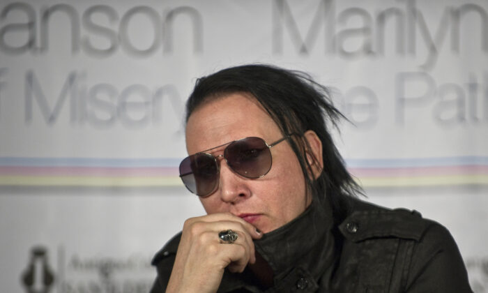 U.S. singer Marilyn Manson listens during a press conference in Mexico City on Nov. 2, 2011. (Ronaldo Schemidt/AFP via Getty Images)
