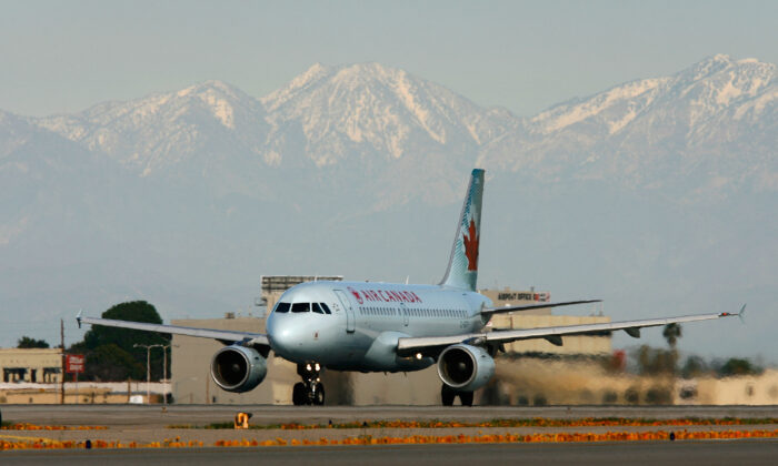 An Air Canada jet lands at Los Angels International Airport in Los Angeles on Feb. 26, 2008. (David McNew/Getty Images)